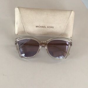 Michael Kors Clear Frame Sunglasses with mirrored smoke lenses.